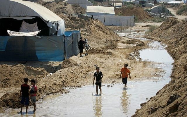 Palestinians inspect the damage after Egyptian forces flooded smuggling tunnels dug beneath the Gaza-Egypt border, in Rafah in the southern Gaza Strip, on September 18, 2015. (Photo by Abed Rahim Khatib/ Flash90) Palestinians inspect the damage after Egyptian forces flooded smuggling tunnels dug beneath the Gaza-Egypt border, in Rafah in the southern Gaza Strip, on September 18, 2015. (Photo by Abed Rahim Khatib/ Flash90)