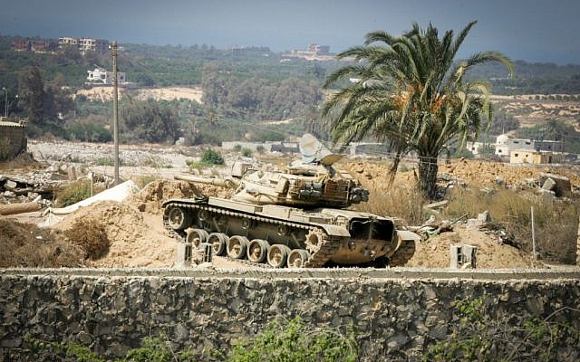 An Egyptian tank is seen from the border of southern Gaza Strip with Egypt September 18, 2015. According to Palestinian witnesses, Egyptian forces pumped water from the Mediterranean Sea through pipes to destroy smuggling tunnels dug beneath the Gaza-Egypt border. (Photo by Abed Rahim Khatib/Flash90) An Egyptian tank is seen from the border of southern Gaza Strip with Egypt September 18, 2015. According to Palestinian witnesses, Egyptian forces pumped water from the Mediterranean Sea through pipes to destroy smuggling tunnels dug beneath the Gaza-Egypt border. (Photo by Abed Rahim Khatib/Flash90)