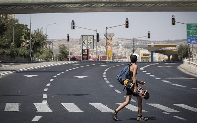 An man walks on an empty streen in Jerusalem on Yom Kippur on September 22, 2015. (Hadas Parush/Flash90)