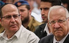 President Reuven Rivlin, right, and Defense Minister Moshe Ya'alon seen at a state ceremony marking 42 years since the Yom Kippur War, held at the military cemetery at Jerusalem's Mount Herzl, on September 24, 2015. (Hadas Parush/Flash90)