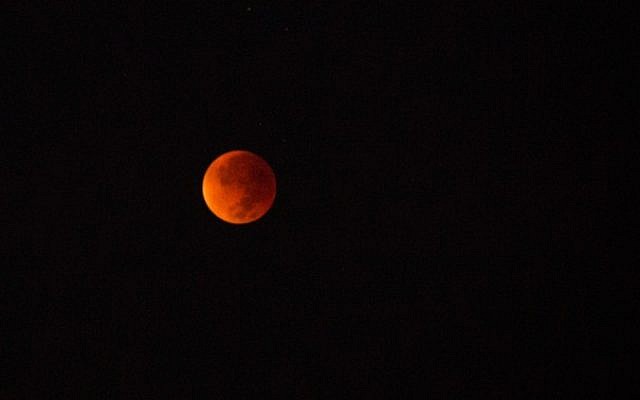 View of a total lunar eclipse combined with a so-called supermoon in Tel Aviv, Israel, on September 28, 2015. (Miriam Alster/ Flash90) View of a total lunar eclipse combined with a so-called supermoon in Tel Aviv, Israel, on September 28, 2015. (Miriam Alster/ Flash90)