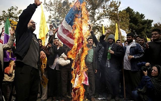 Iranian protesters burn an American flag during an annual anti-American rally in Tehran, Iran, Monday, Nov. 4, 2013. (Ebrahim Noroozi/AP) Iranian protesters burn an American flag during an annual anti-American rally in Tehran, Iran, Monday, Nov. 4, 2013. (Ebrahim Noroozi/AP)