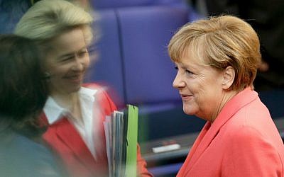 German Chancellor Angela Merkel (right), talks to German Defense Minister Ursula von der Leyen (second left) and German Labor Minister Andrea Nahles (left) as she arrives for a meeting of the German Federal Parliament at the Reichstag in Berlin, Germany, September 24, 2015. (AP/Michael Sohn) German Chancellor Angela Merkel (right), talks to German Defense Minister Ursula von der Leyen (second left) and German Labor Minister Andrea Nahles (left) as she arrives for a meeting of the German Federal Parliament at the Reichstag in Berlin, Germany, September 24, 2015. (AP/Michael Sohn)