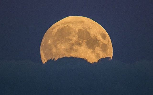 A full moon rises between clouds in Berlin, Germany, Sunday, Sept. 27, 2015. (AP/Gero Breloer) A full moon rises between clouds in Berlin, Germany, Sunday, Sept. 27, 2015. (AP/Gero Breloer)