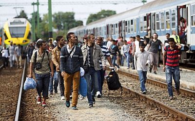 Migrants and refugees arrive at the railway station in Szentgotthard, 246 kilometers southwest of Budapest, Hungary, near the Austrian border, Sept. 19, 2015. (Gyorgy Varga/MTI via AP) Migrants and refugees arrive at the railway station in Szentgotthard, 246 kilometers southwest of Budapest, Hungary, near the Austrian border, Sept. 19, 2015. (Gyorgy Varga/MTI via AP)
