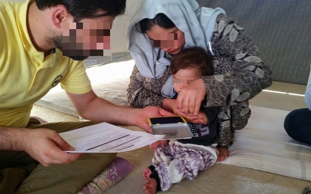 CYCI mediator documents the release of a Yazidi woman and her child. (courtesy) CYCI mediator documents the release of a Yazidi woman and her child. (courtesy)