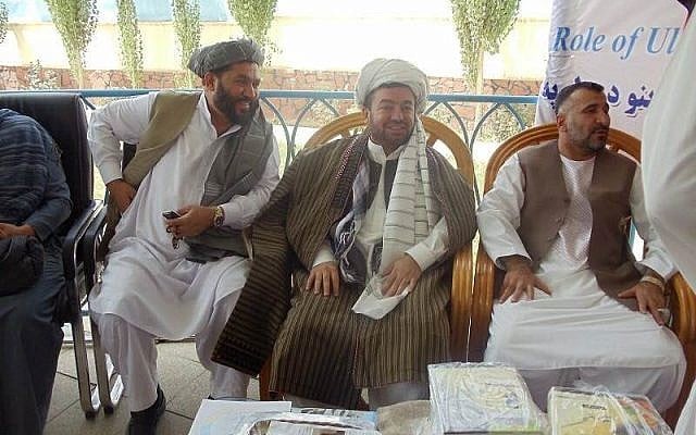 Antepli Antepli, in traditional Afghan clothes, addresses a group of religious scholars in Wardak, Afghanistan in 2010 (Courtesy)
