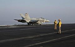A US Marine fighter jet aircraft aboard the USS Theodore Roosevelt aircraft carrier, which serves as a base for air strikes in Syria, September 10, 2015. (Marko Drobnjakovic/AP)
