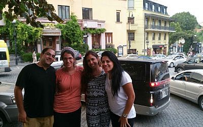 Left to right, Liad Shemesh, an Israeli tourist, outside the Great Synagogue of Tbilisi with his wife, Einat, Adi Amram and Ortal Panehla on August 20, 2015. (Cnaan Liphshiz/JTA)