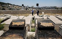 A view of the desecrated tombstones that were vandalized in the Mount of Olives cemetery in East Jerusalem on June 23, 2015. (Yonatan Sindel/Flash90)