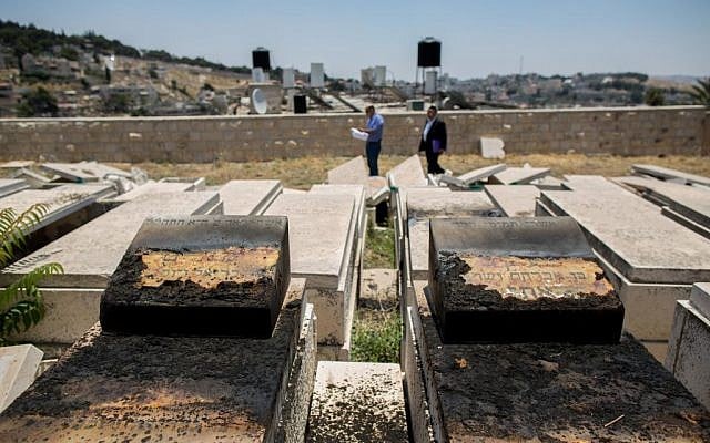 A view of the desecrated tombstones that were vandalized in the Mount of Olives cemetery in East Jerusalem on June 23, 2015. (Yonatan Sindel/Flash90) A view of the desecrated tombstones that were vandalized in the Mount of Olives cemetery in East Jerusalem on June 23, 2015. (Yonatan Sindel/Flash90)