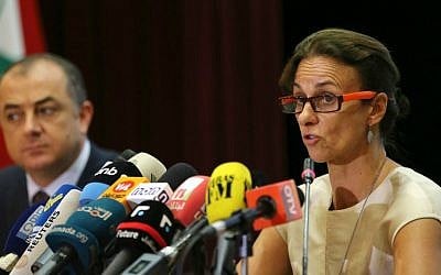 UNICEF representative Tanya Chapuisat, right, reads a statement as she sits next to Lebanon's Minister of Education Elias Bou Saab during a press conference in Beirut, Lebanon, Monday, Sept. 21, 2015. (AP Photo/Hussein Malla)
