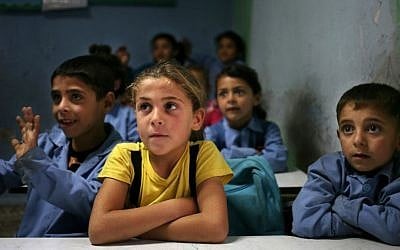 In this May 29, 2014 file photo, Syrian refugee students sit in their classroom at a Lebanese public school where only Syrian students attend classes in the afternoon in Kaitaa village in north Lebanon. (AP Photo/Hussein Malla, File)