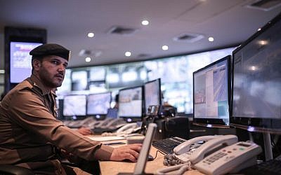 Saudi security officers monitor screens with live views of Muslim pilgrims in the holy city of Mecca, along with highways and high density areas, a few days before the start of the annual pilgrimage, known as the hajj, in Mecca, Saudi Arabia, Saturday, Sept. 19, 2015. (AP Photo/Mosa'ab Elshamy)