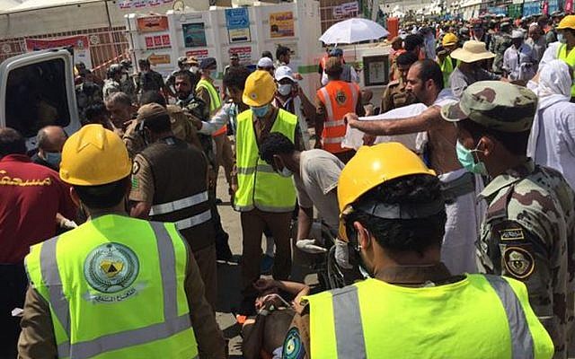 In this image posted on the official Twitter account of the directorate of the Saudi Civil Defense agency, rescuers respond to a stampede that killed and injured pilgrims in the holy city of Mina during the annual hajj pilgrimage on Thursday, Sept. 24, 2015. (Directorate of the Saudi Civil Defense agency via AP) In this image posted on the official Twitter account of the directorate of the Saudi Civil Defense agency, rescuers respond to a stampede that killed and injured pilgrims in the holy city of Mina during the annual hajj pilgrimage on Thursday, Sept. 24, 2015. (Directorate of the Saudi Civil Defense agency via AP)