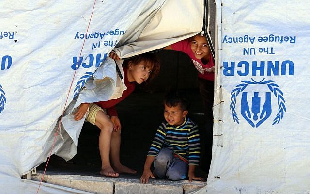 Syrian refugee children look from their tent during a visit by UN humanitarian chief Stephen O'Brien to the Zaatari Refugee Camp, near Mafraq, Jordan, Saturday, Sept. 19, 2015. (AP Photo/Raad Adayleh) Syrian refugee children look from their tent during a visit by UN humanitarian chief Stephen O'Brien to the Zaatari Refugee Camp, near Mafraq, Jordan, Saturday, Sept. 19, 2015. (AP Photo/Raad Adayleh)