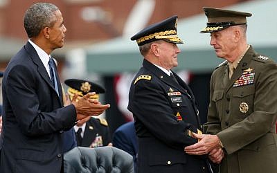 President Barack Obama watches as newly sworn-in Joint Chiefs Chairman Gen. Joseph Dunford Jr., right, shakes hands with retiring Joint Chiefs Chairman Gen. Martin Dempsey during his Armed Forces Full Honors Retirement Ceremony for Dempsey, Sept. 25, 2015, at Fort Myer in Arlington, Va. (AP Photo/Andrew Harnik)