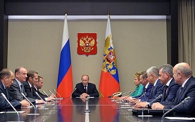 Russian President Vladimir Putin, center, listens as he meets with members of Russia's Security Council in the Novo-Ogaryovo residence outside Novo-Ogaryovo, Russia, Tuesday, Sept. 29, 2015. (Alexei Druzhinin, RIA-Novosti, Kremlin Pool Photo via AP)
