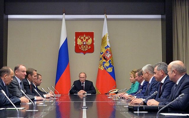 Russian President Vladimir Putin, center, listens as he meets with members of Russia's Security Council in the Novo-Ogaryovo residence outside Novo-Ogaryovo, Russia, Tuesday, Sept. 29, 2015. (Alexei Druzhinin, RIA-Novosti, Kremlin Pool Photo via AP) Russian President Vladimir Putin, center, listens as he meets with members of Russia's Security Council in the Novo-Ogaryovo residence outside Novo-Ogaryovo, Russia, Tuesday, Sept. 29, 2015. (Alexei Druzhinin, RIA-Novosti, Kremlin Pool Photo via AP)