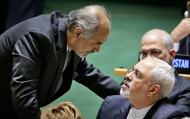 Syrian Ambassador to the United Nations Bashar Jaafari, left, talks with Iran's Foreign Minister Mohammad Javad Zarif during the 70th session of the United Nations General Assembly at UN headquarters, Monday, Sept. 28, 2015. (AP Photo/Seth Wenig)