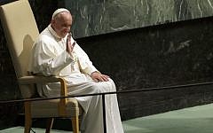 Pope Francis waves at the audience while sitting in the head of state chair after addressing the 70th session of the United Nations General Assembly, Friday, Sept. 25, 2015 at United Nations headquarters. (AP Photo/Mary Altaffer)