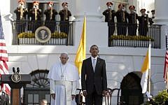 President Barack Obama and Pope Francis stand at attention during the playing of the national anthems during a state arrival ceremony for the pope, Sept. 23, 2015, on the South Lawn of the White House in Washington. (AP/Pablo Martinez Monsivais)