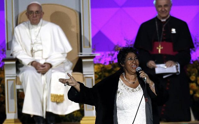 Aretha Franklin performs as Pope Francis is seated nearby during the Festival of Families, Saturday, Sept. 26, 2015, in Philadelphia. (AP Photo/Matt Slocum)