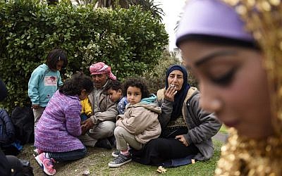 Syrian refugees gather at Independence Square, in Montevideo, Uruguay, Monday, Sept. 7, 2015. (AP Photo/Matilde Campodonico)