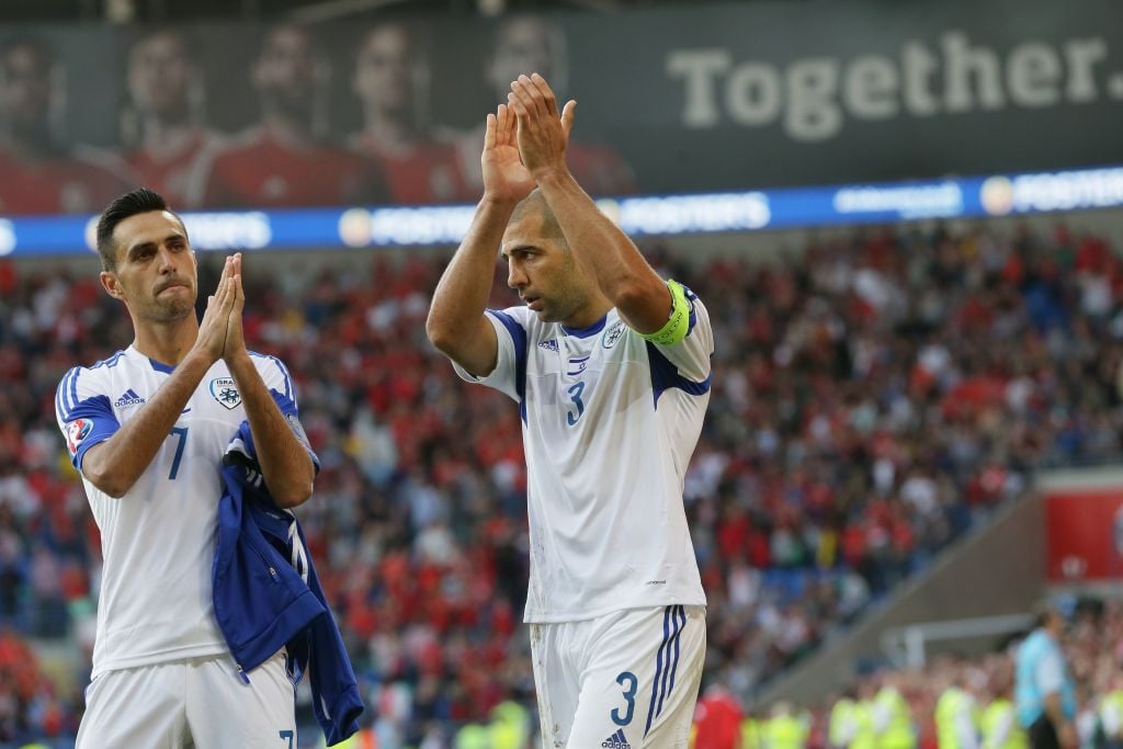 Israel’s Tal Ben Haim I, right, and Eran Zahavi applaud their fans after drawing the Euro 2016 Group B qualifying match between Israel and Wales at the Cardiff City stadium in Cardiff, Wales, Sunday, September 6, 2015. (Tim Ireland/AP) Israel’s Tal Ben Haim I, right, and Eran Zahavi applaud their fans after drawing the Euro 2016 Group B qualifying match between Israel and Wales at the Cardiff City stadium in Cardiff, Wales, Sunday, September 6, 2015. (Tim Ireland/AP)