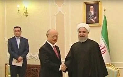 IAEA chief Yukiya Amano meets with Iranian President Hassan Rouhani (right) in Tehran on September 20, 2015. (YouTube screen capture)