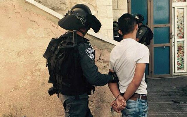 Illustrative: A Border Police officer arrests a Palestinian man in the East Jerusalem neighborhood of Jabel Mukaber on September 18, 2015. (Israel Police) Illustrative: A Border Police officer arrests a Palestinian man in the East Jerusalem neighborhood of Jabel Mukaber on September 18, 2015. (Israel Police)