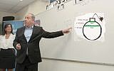 Benjamin Netanyahu in a school on September 1 pointing to another type of green line in a crudely-made photo illustration. (Nir Keidar/POOL/composite)