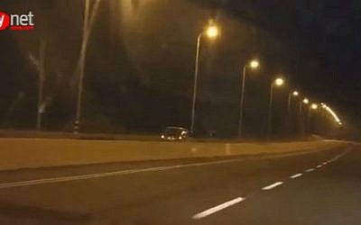 Footage of vehicle traveling against the direction of traffic on Highway 2 north of Tel Aviv, early Tuesday, September 8, 2015. (screen capture/Ynet)