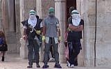 Still image taken from a video released by an Israel Police spokesman showing Palestinians gearing up for a confrontation on the Temple Mount in Jerusalem on Sunday, September 13, 2015. (screen capture: Israel Police)