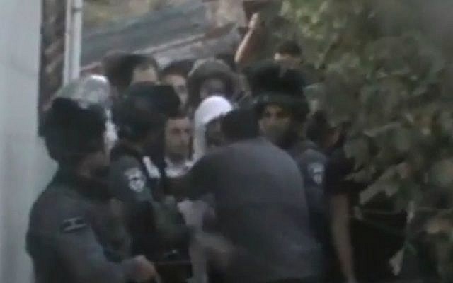 Israel security forces escort five yeshiva students from a Palestinian home in Hebron on August 3, 2015, where they had been offered shelter after their presence in the West Bank city sparked riots. (screen capture: NRG website) Israel security forces escort five yeshiva students from a Palestinian home in Hebron on August 3, 2015, where they had been offered shelter after their presence in the West Bank city sparked riots. (screen capture: NRG website)