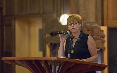 In this file photo, Idit Klein, executive director of the Boston-based Keshet for LGBTQ Jews and their allies, addresses up to 200 attendees at a Memorial and Solidarity Gathering at Boston's Temple Israel on September 9, 2015 (Elan Kawesch/The Times of Israel)