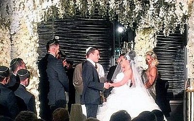 Anna Goldshmidt and Elan Stratiyevsky at their traditional Jewish ceremony at the Waldorf Astoria Hotel in New York City, June 13, 2015 (@gflorence/Instagram/JTA)