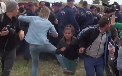 A Hungarian TV camerawoman seen kicking a child migrant during disturbances at Roszke, southern Hungary, September 8, 2015 (YouTube screen cap)