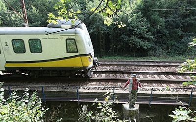 A man stands by the rail tracks near a place where a legend says a Nazi train with gold might be hidden near Walbrzych, Poland, on Wednesday, September 2, 2015. (Czarek Sokolowski/AP) A man stands by the rail tracks near a place where a legend says a Nazi train with gold might be hidden near Walbrzych, Poland, on Wednesday, September 2, 2015. (Czarek Sokolowski/AP)