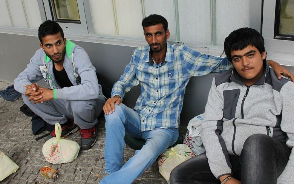 Syrian refugee Khalid el-Hassan, right, spent more than 10 days trying to register with authorities after arriving in Berlin, September 17, 2015. (Uriel Heilman/JTA) Syrian refugee Khalid el-Hassan, right, spent more than 10 days trying to register with authorities after arriving in Berlin, September 17, 2015. (Uriel Heilman/JTA)