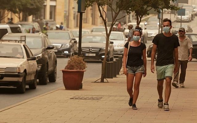 Lebanese citizens, cover their face with masks during a sandstorm, in downtown Beirut, Lebanon, Tuesday, Sept. 8, 2015. (AP Photo/Bilal Hussein) Lebanese citizens, cover their face with masks during a sandstorm, in downtown Beirut, Lebanon, Tuesday, Sept. 8, 2015. (AP Photo/Bilal Hussein)
