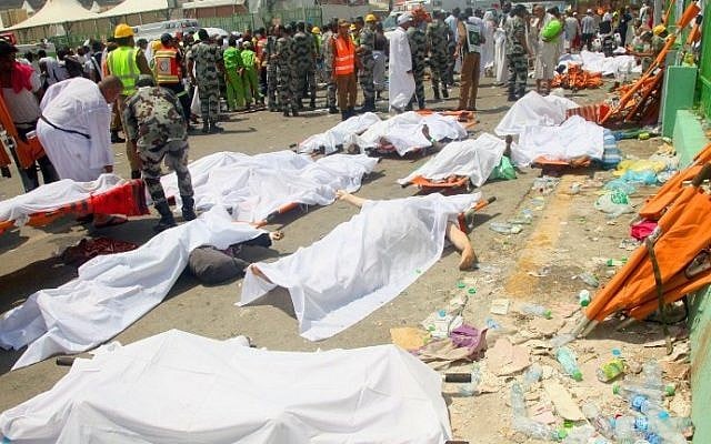 Saudi emergency personnel and pilgrims stand near bodies covered in sheets at the site where hundreds were killed in a stampede in Mina, near the holy city of Mecca, at the annual hajj in Saudi Arabia on September 24, 2015. (AFP/STR) Saudi emergency personnel and pilgrims stand near bodies covered in sheets at the site where hundreds were killed in a stampede in Mina, near the holy city of Mecca, at the annual hajj in Saudi Arabia on September 24, 2015. (AFP/STR)