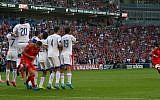 Wales's midfielder Gareth Bale (R) takes an unsuccessful freekick during the Euro 2016 qualifying group B football match between Wales and Israel at Cardiff City Stadium in Cardiff, south Wales, on September 6, 2015. (AFP/ GEOFF CADDICK)