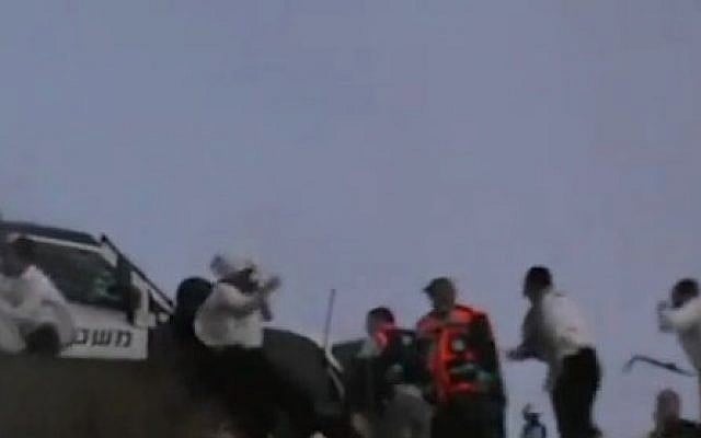 American yeshiva students rush to a police car after they were rescued in Hebron by Israeli security forces on September 3, 2015. (screen capture: Ynet) American yeshiva students rush to a police car after they were rescued in Hebron by Israeli security forces on September 3, 2015. (screen capture: Ynet)