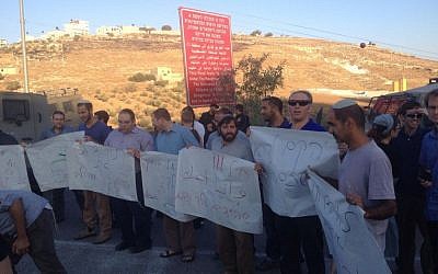 Tekoa residents protest after a spate of stone-throwing attacks at vehicles on the main road to the settlement, September 21, 2015 (Courtesy) 