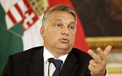 Hungarian Prime minister Viktor Orban speaks during a press conference at the Hungarian Embassy on September 25, 2015 in Vienna. (AFP PHOTO / DIETER NAGL)