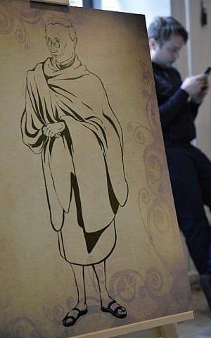 A visitor stands next to an artwork depicting Russian President Vladimir Putin as Indian independence leader Mahatma Gandhi during the 'Putin Universe' exhibition in Moscow on October 6, 2015. (Natalia Kolesnikova/AFP)