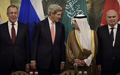 (From left) Russian Foreign Minister Sergei Lavrov, US Secretary of State John Kerry, Saudi Foreign Minister Adel al-Jubeir and Turkish Foreign Minister Feridun Sinirlioglu stand together before a meeting at the Hotel Imperial on October 29, 2015 in Vienna, Austria. (AFP PHOTO / POOL / BRENDAN SMIALOWSKI)