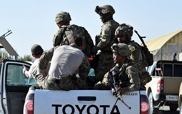 US army personnel ride in a truck inside an Afghan military base during fighting between Taliban militants and Afghan security forces in Kunduz on October 1, 2015. (AFP Photo/Wakil Kohsar) US army personnel ride in a truck inside an Afghan military base during fighting between Taliban militants and Afghan security forces in Kunduz on October 1, 2015. (AFP Photo/Wakil Kohsar)