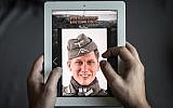 Illustrative photo of a man browsing the website of DiD, a company that produced a Nazi-uniform-clad figurine with a face similar to Bastian Schweinsteiger, in Hong Kong on October 23, 2015. (AFP/Philippe Lopez)